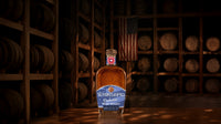 WhistlePig Declaration wheat whiskey with poured glass