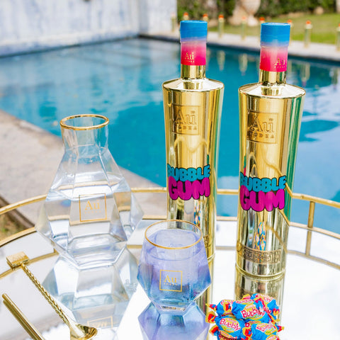 Au Vodka Bubblegum flavored vodka mirror-gold 700ml bottle poolside