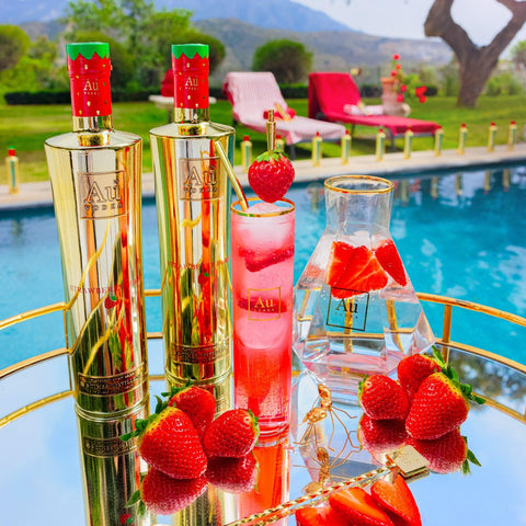 Au Vodka Strawberry Burst flavored vodka mirror-gold 750ml bottle poolside